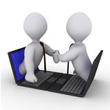 Businessmen handshake through laptop