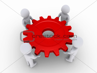 Four people holding cog
