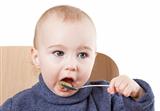 baby eating applesauce