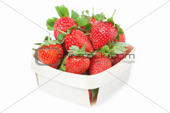 Red Strawberries in a basket. Closeup. On a white background.