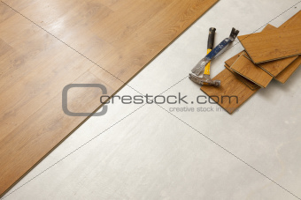 Worn Hammer and Pry Bar with Laminate Flooring Abstract with Copy Room.