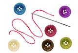 bright sewing buttons and needle with thread isolated on white