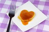 Mini heart-shaped pancake with syrup