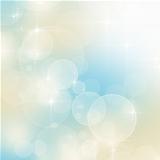 Abstract blue and beige bokeh background with copy space 
