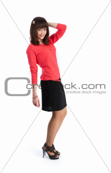 Portrait of a happy young woman standing on white background