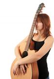 redhead Girl with guitar on a white background
