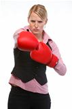 Anger woman employee in boxing gloves punching