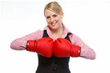Smiling woman employee in boxing gloves