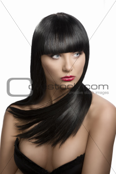 girl's portrait with long dark hair, she looks at left