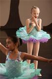 Young Ballet Student Watches Friend