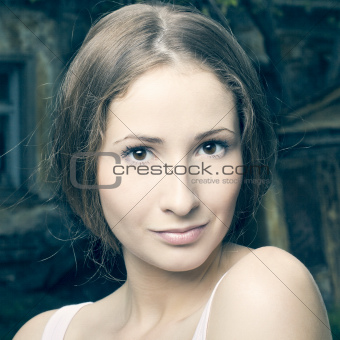 Fashion portrait of beautiful woman posing on bright background
