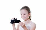 preteen girl with video camera