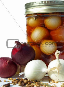 Spices with jar of pickled onions