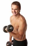 Muscular young man lifting a dumbbell over white