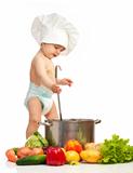 Little boy with ladle, casserole, and vegetables