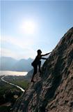 Silhouette of female rock climber