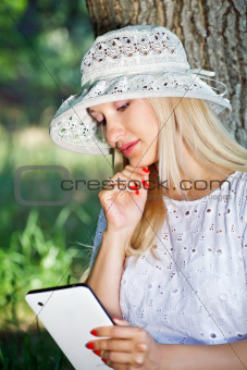 Beautiful girl with a Tablet PC
