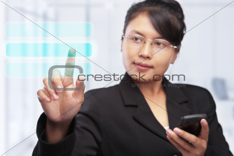 Asian businesswoman with touch screen