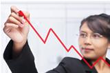 Asian businesswoman drawing graph with red felt tip pen
