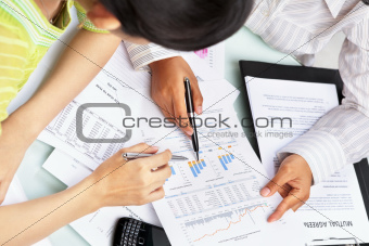 Two woman working on statistic