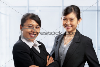 Two Asian businesswoman in office