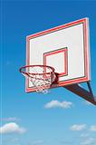 Basketball hoop on blue sky background