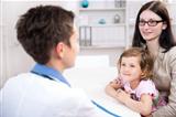 Pediatrician talking to mother and child 