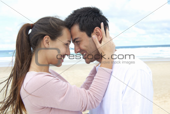 couple in love on the beach flirting