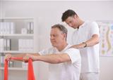 Physiotherapy: Senior man and physiotherapist