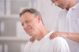Physiotherapy: Physiotherapist massaging patient