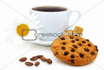 Shortbread cookies, coffee beans and a cup of coffee.
