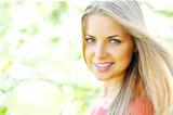 Closeup of happy cheerful smiling young beautiful blond woman, o