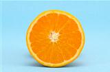 half orange fruit on azure background