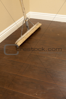 Push Broom on a Newly Installed Laminate Floor and New Baseboards.