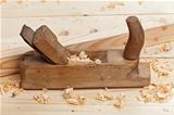 Wooden workbench, plane and shavings