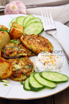 Zucchini Fritters and slices of new potatoes.