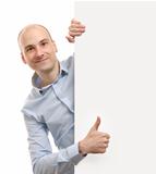 man with blank banner showing thumbs up gesture