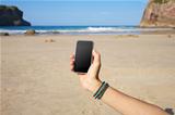 blank smartphone in the beach
