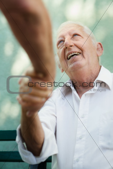 Group of happy elderly men laughing and talking