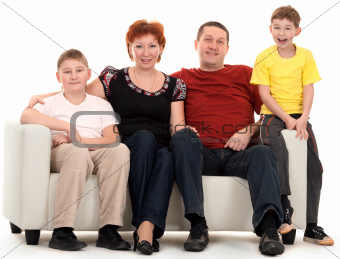 Family of four on a sofa
