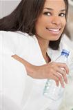 African American Woman Drinking Bottle of Water
