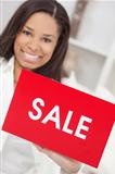 African American Woman Holding Sale Sign