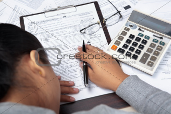 Woman stress with tax form