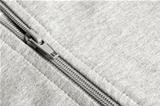 Closeup of zipper in gray cloth