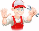Happy plumber or mechanic with spanner