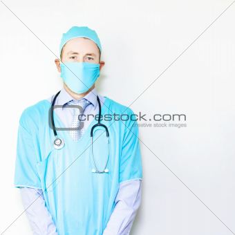 Young male doctor in surgery gown