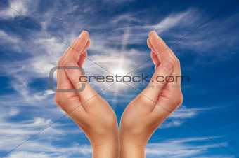  hands over blue sky