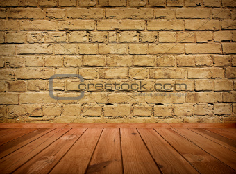 vintage brown grungy textured brick interior with wooden floor