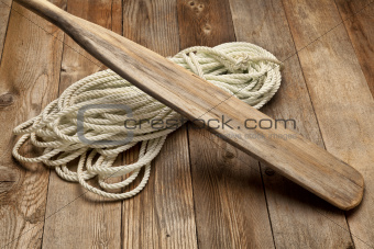 old oar and rope coil