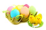 Easter eggs and chicks in nest.